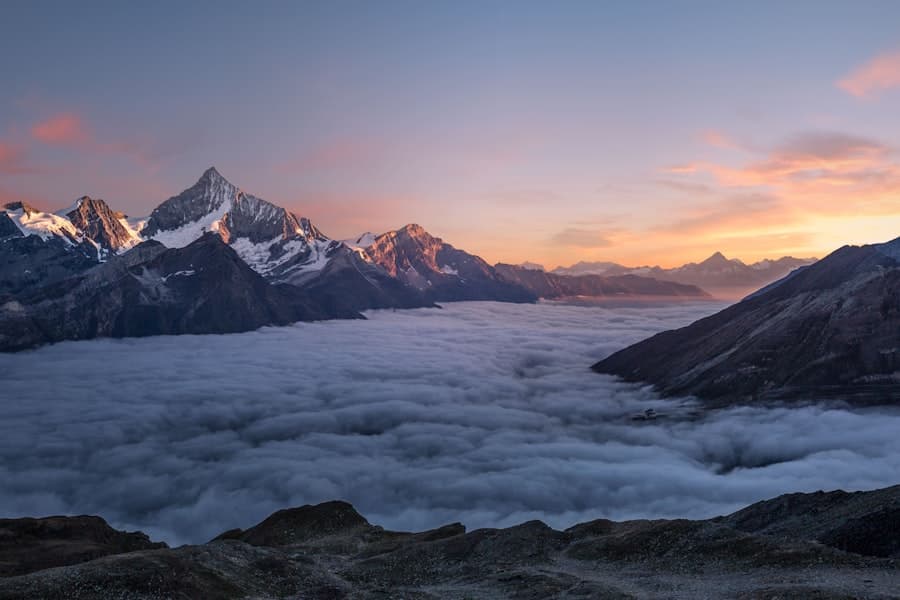 Sierra Nevada alpine peaks above the clouds at sunrise